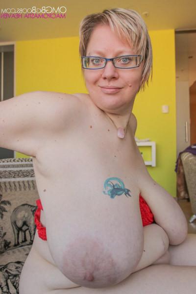 15P Mature blonde babe showing off her humongous boobs