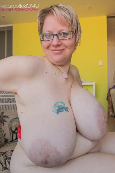 15P Mature blonde babe showing off her humongous boobs
