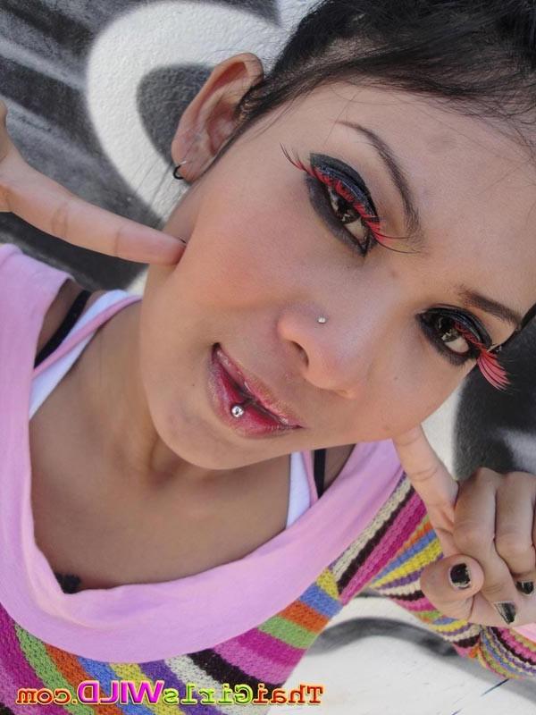 16P Softcore emo thai chick posing outdoors