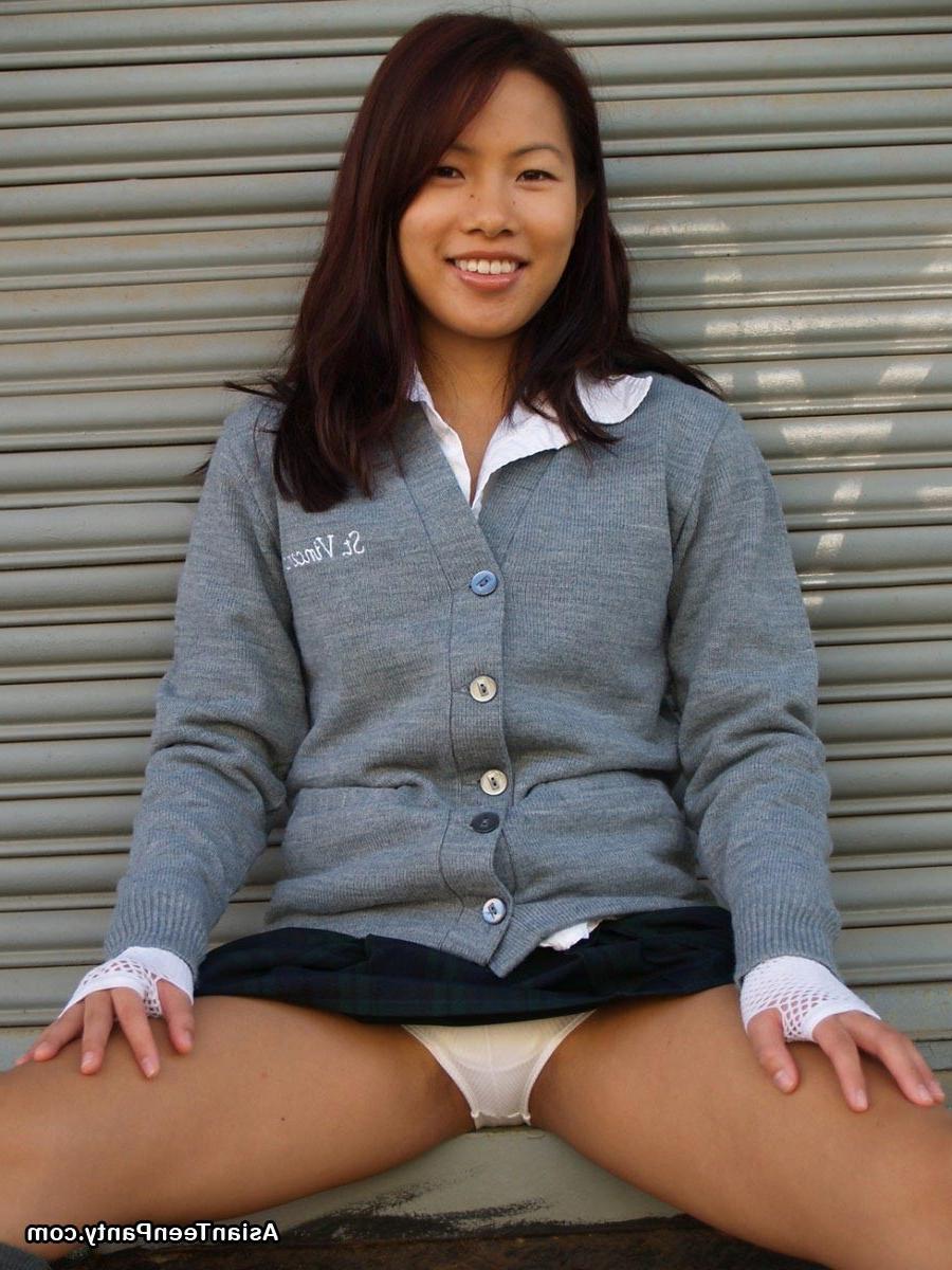 16P Asian schoolgirl outdoors