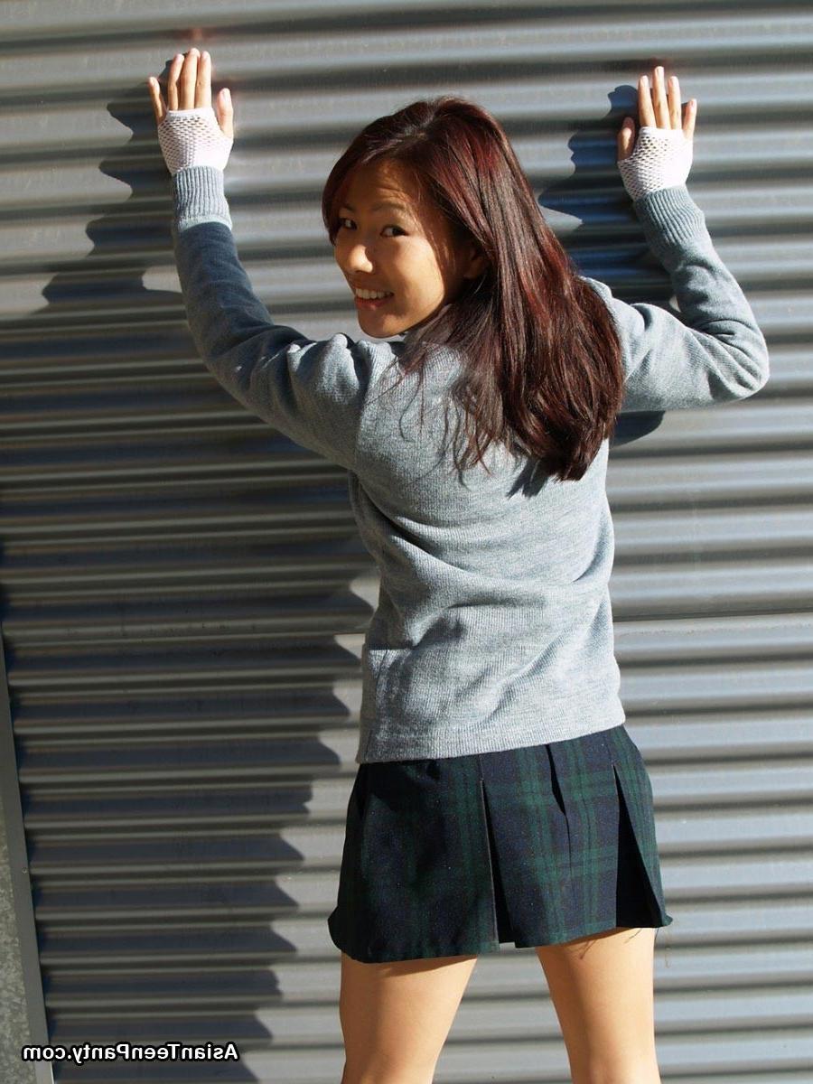 16P Asian schoolgirl outdoors