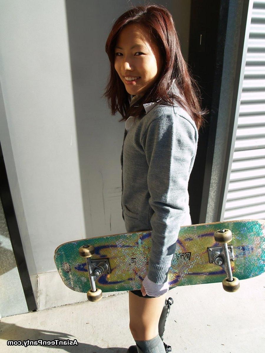 16P Asian schoolgirl outdoors