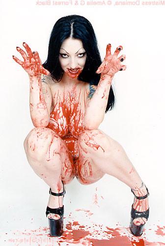 15P Tattooed vampire girl covers herself in blood