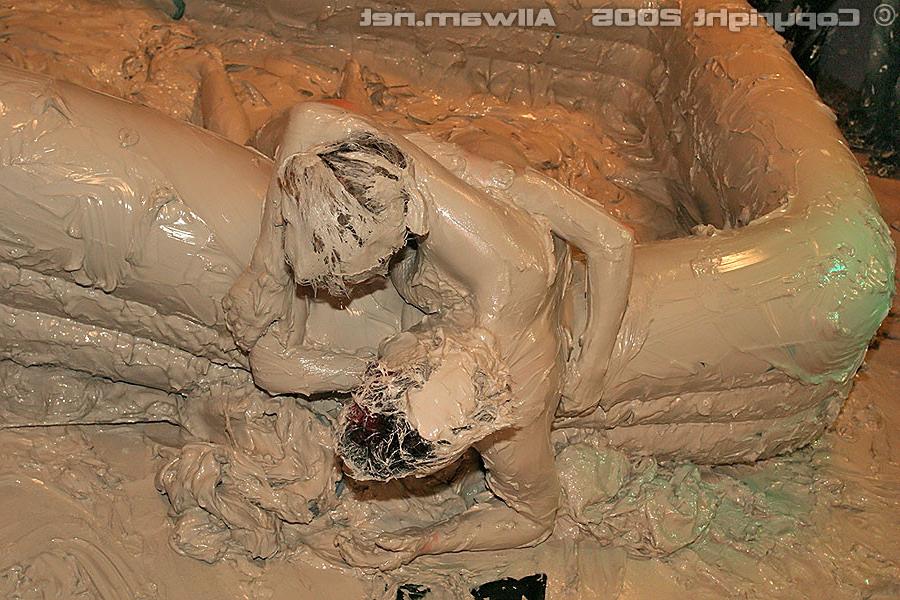 15P Hot babes tearing off their tops while wrestling in the mud