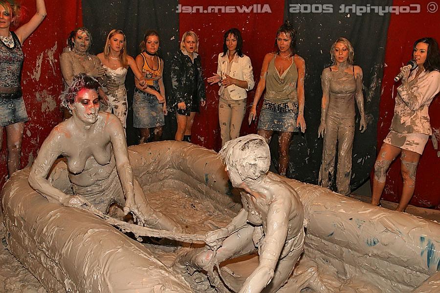 15P Hot babes tearing off their tops while wrestling in the mud