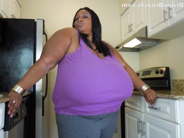 15P Plump black amateur with gigantic boobs shows them off