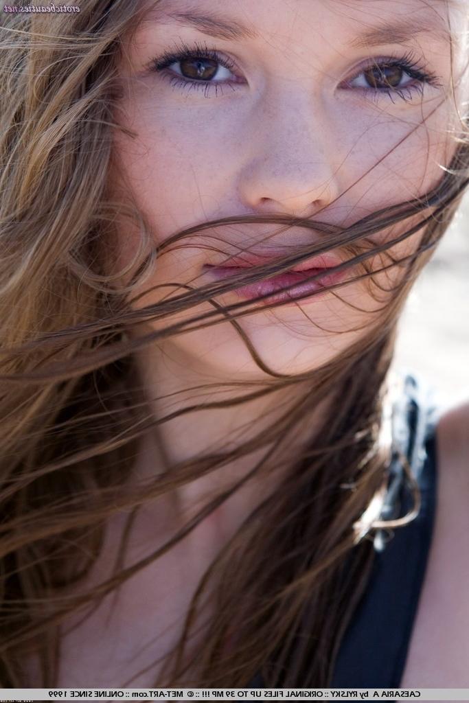 15P Erotic petite teen posing nude on the beach