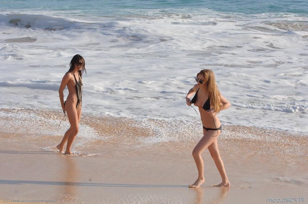 15P Two hot sexy bikini babes flashing their racks on a sandy beach