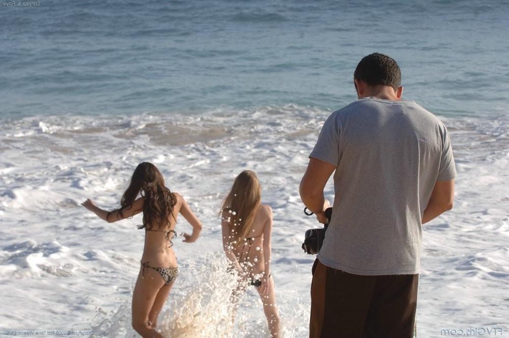 15P Two hot sexy bikini babes flashing their racks on a sandy beach