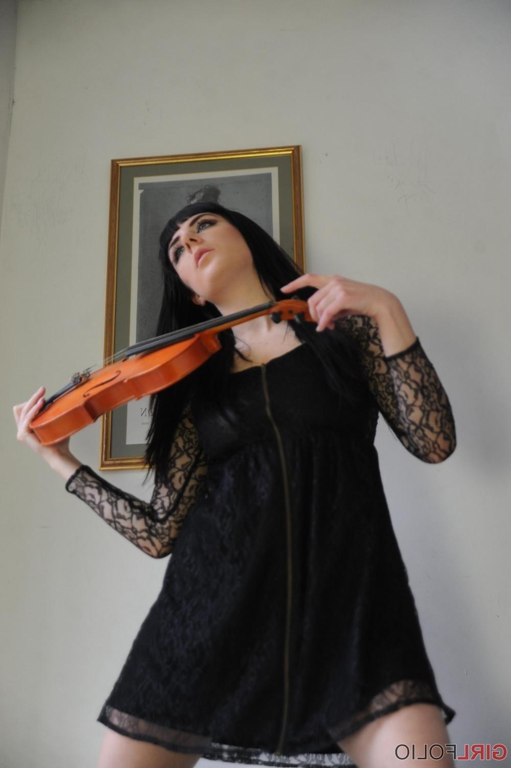 12P Leggy brunette stripping and posing with her violin