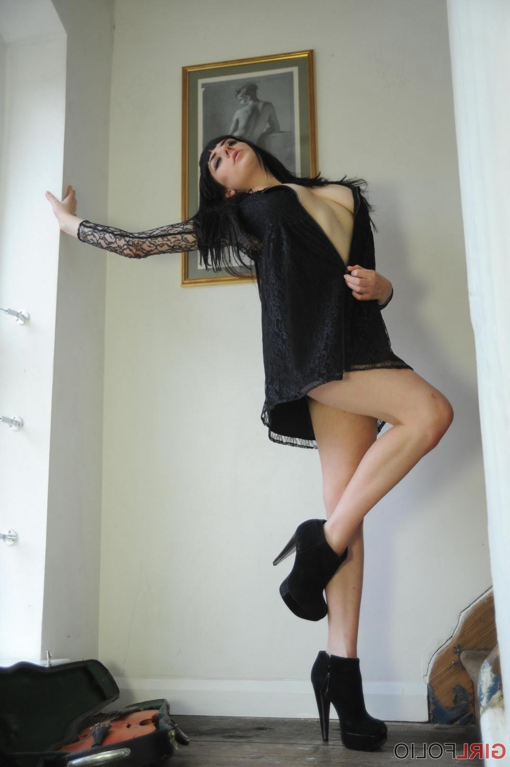 12P Leggy brunette stripping and posing with her violin