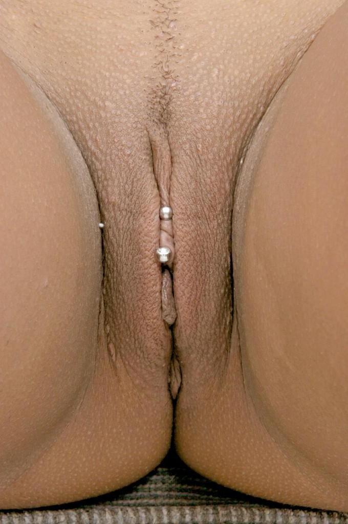 20P Naked ebony gets her pierced shaved pussy stuffed by dildo