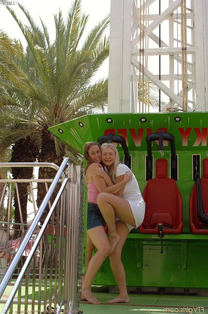 16P Busty amateur babes showing tits outdoors at an amusement park