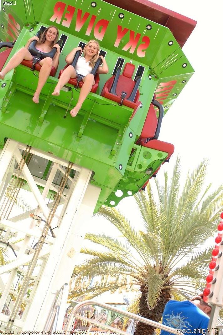 16P Busty amateur babes showing tits outdoors at an amusement park