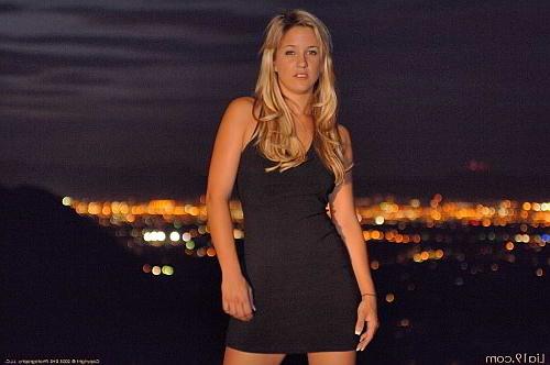 25P Blonde outdoors at night stripping off black dress
