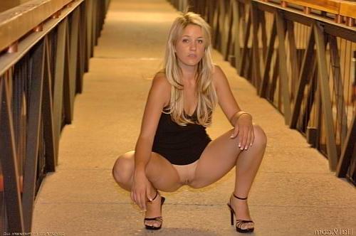 25P Blonde outdoors at night stripping off black dress