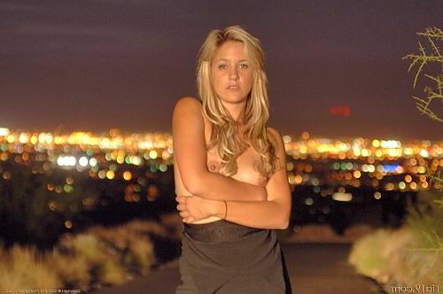 25P Blonde outdoors at night stripping off black dress