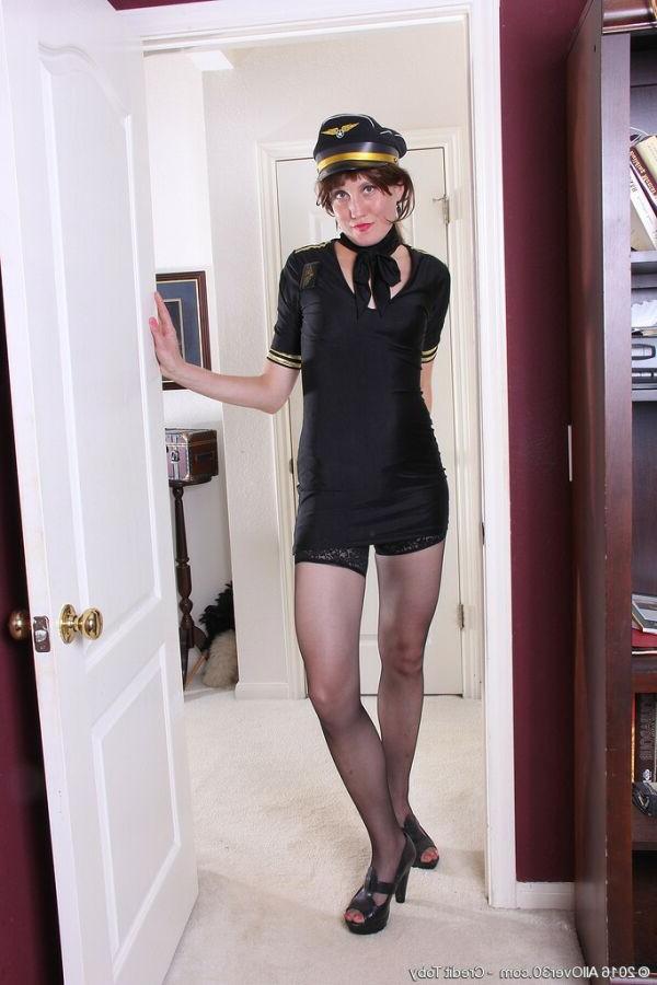 15P Katrina Mathews stewardess in black uniform and stockings