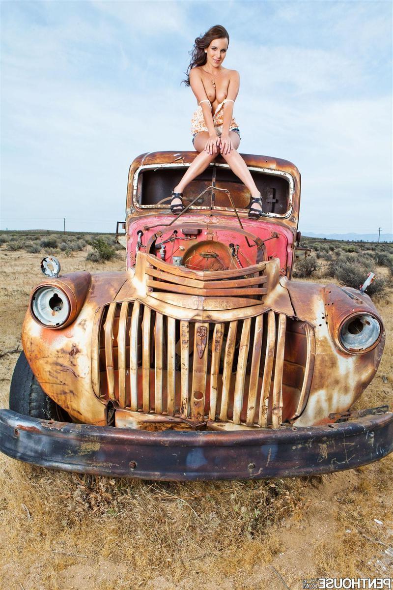 18P Jenna Rose poses on an old rusted pickup truck