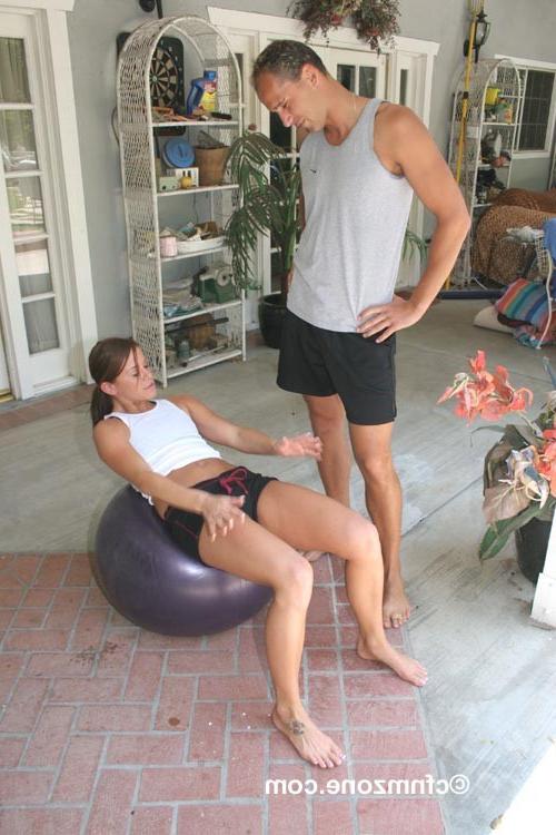 18P Trainer holds a working out guys dick on a leash