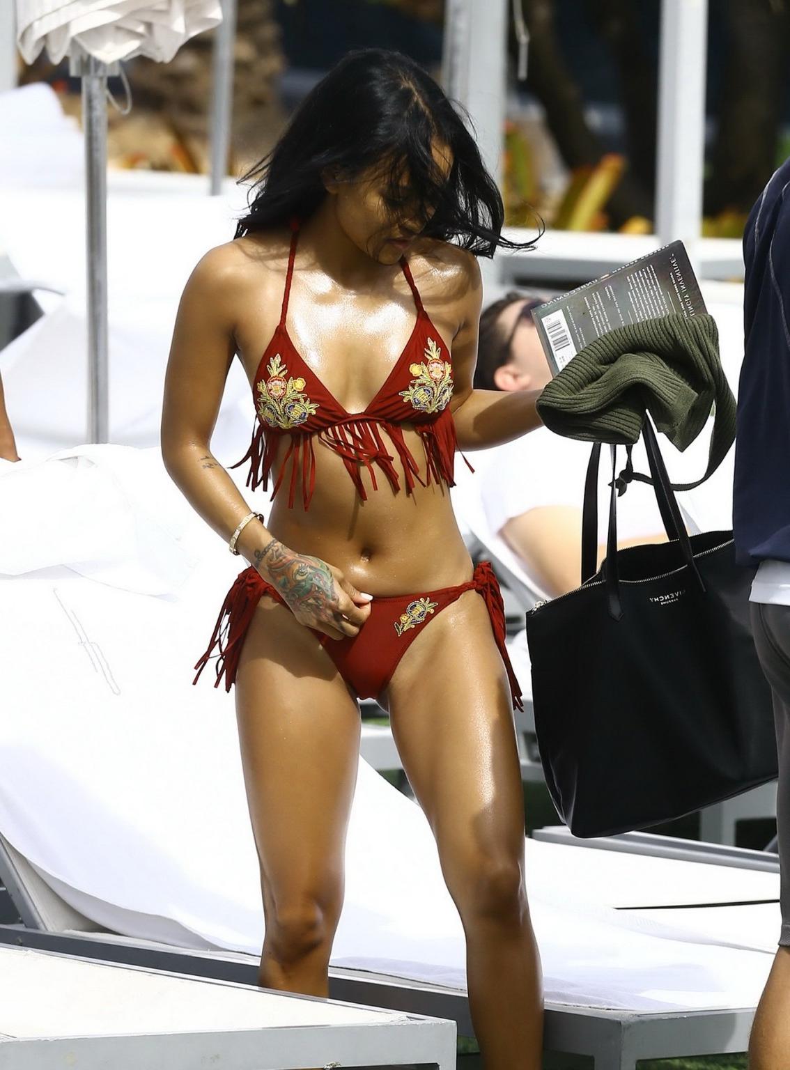 16P Karrueche Tran busty and booty in tiny red bikini poolside