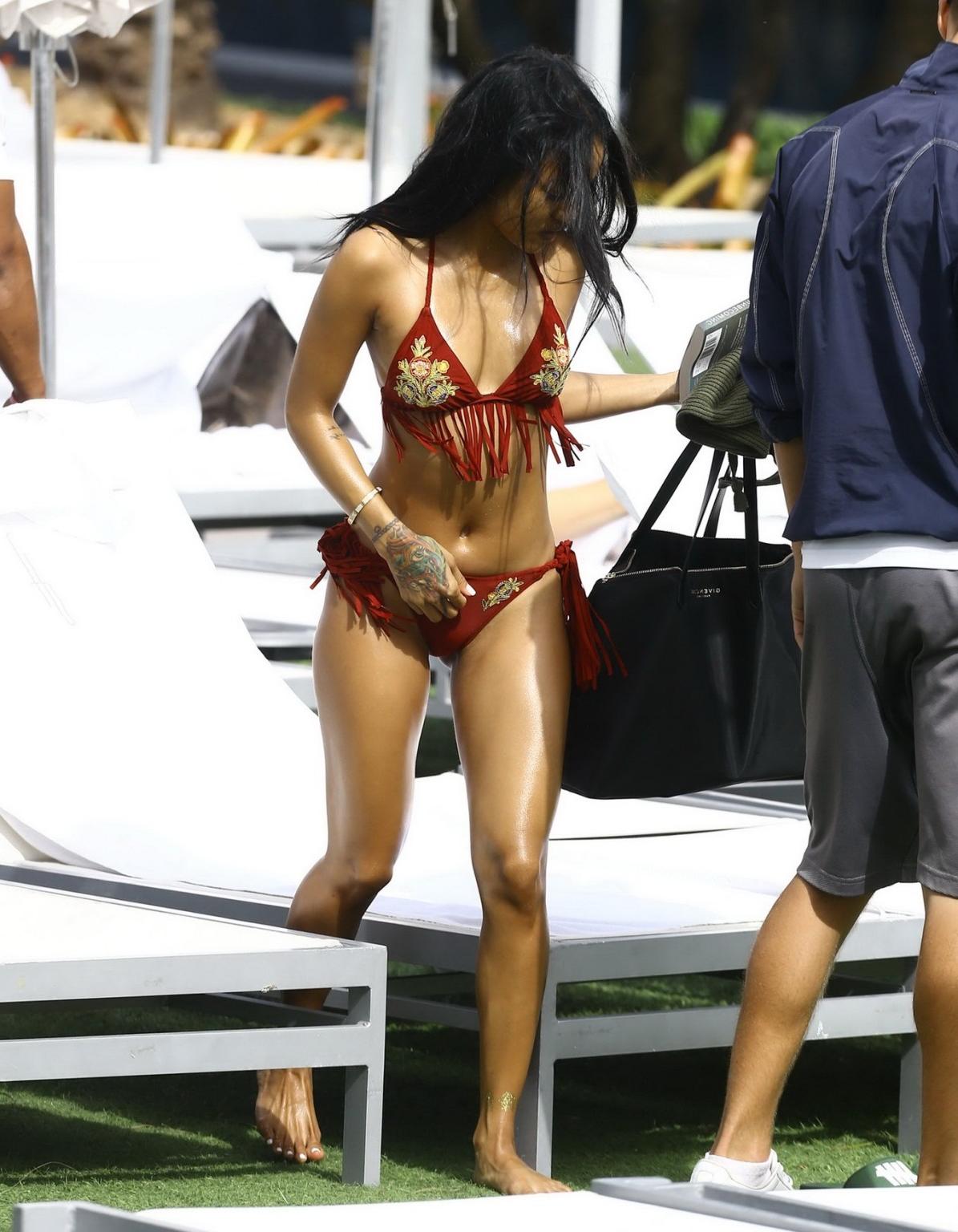 16P Karrueche Tran busty and booty in tiny red bikini poolside