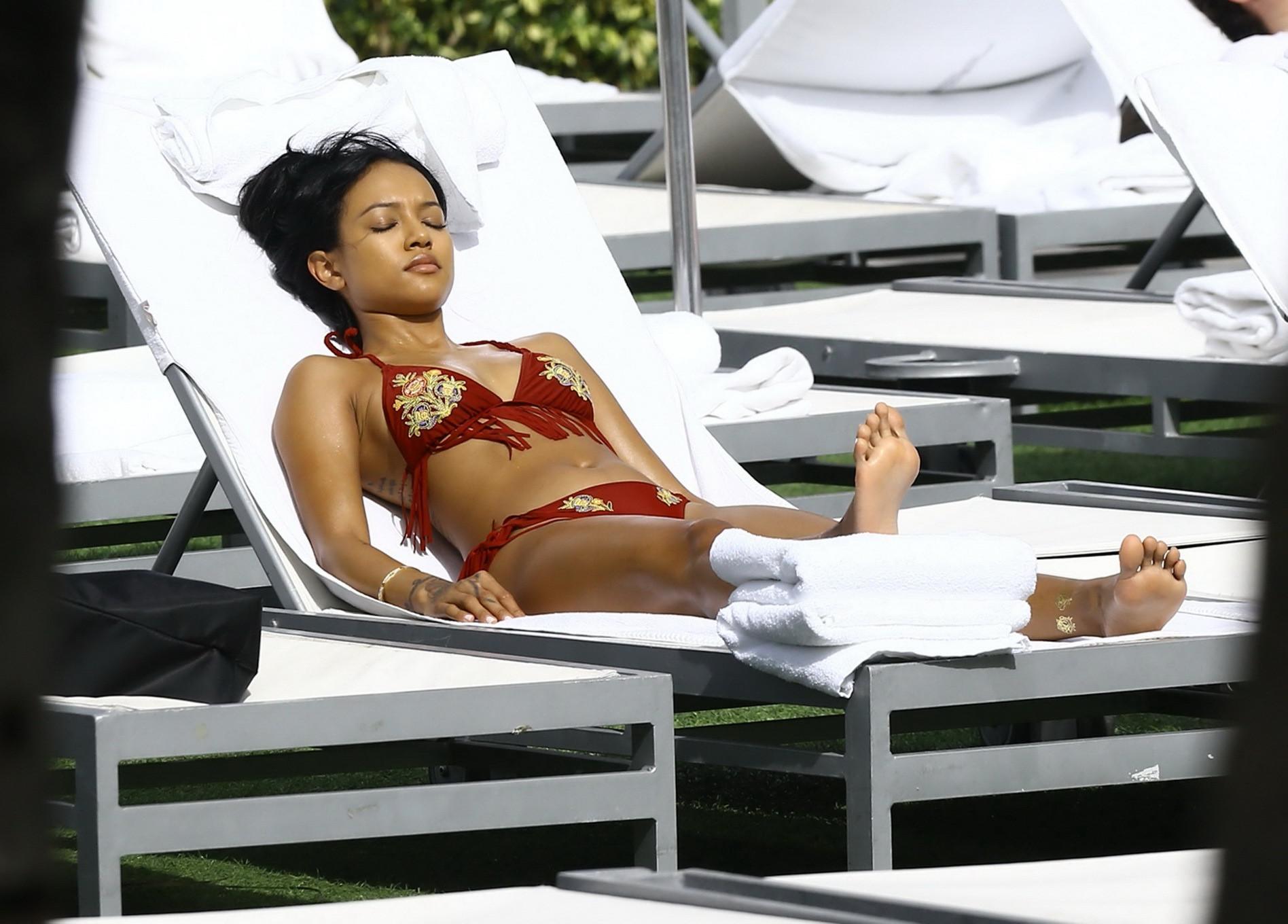 16P Karrueche Tran busty and booty in tiny red bikini poolside