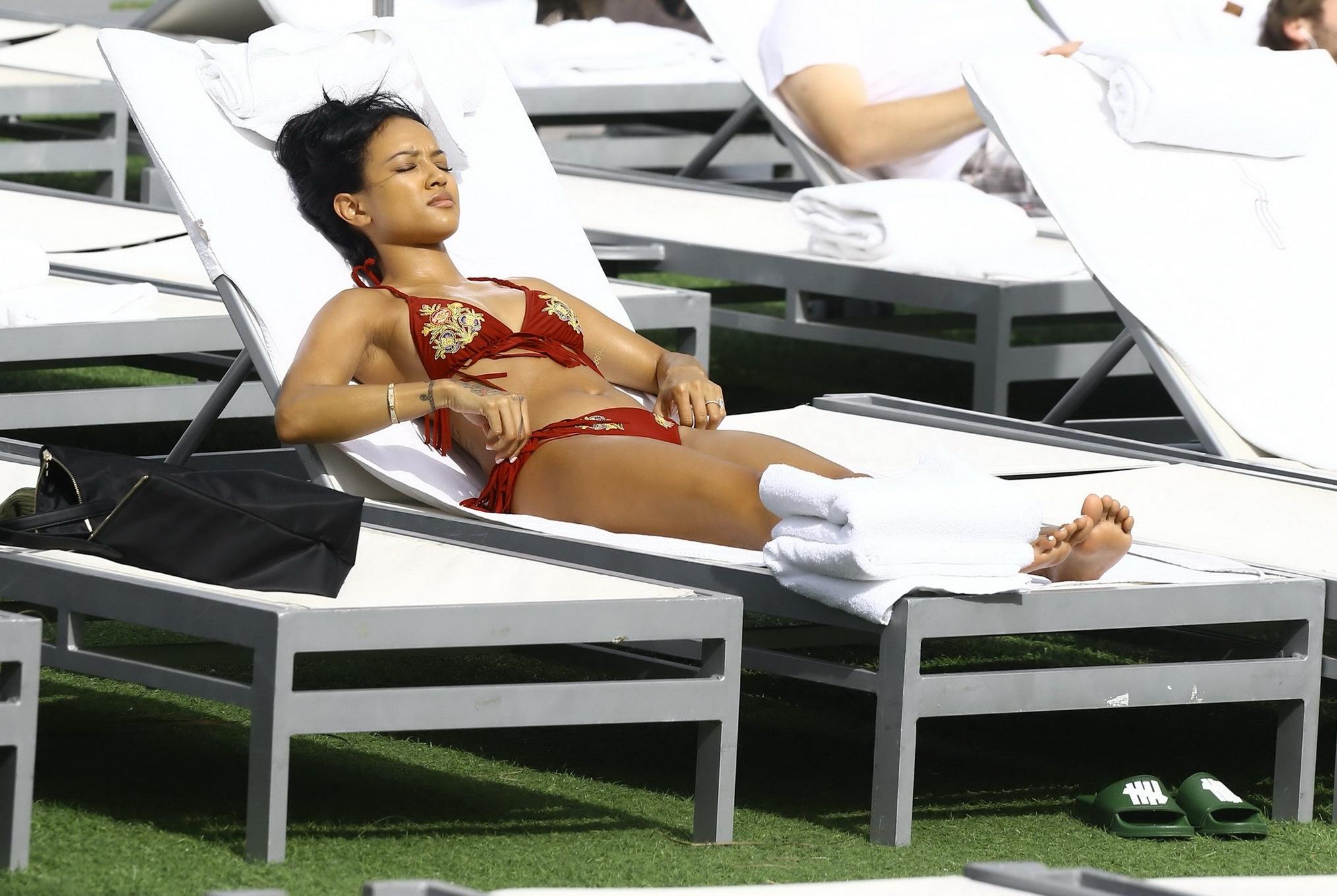 16P Karrueche Tran busty and booty in tiny red bikini poolside