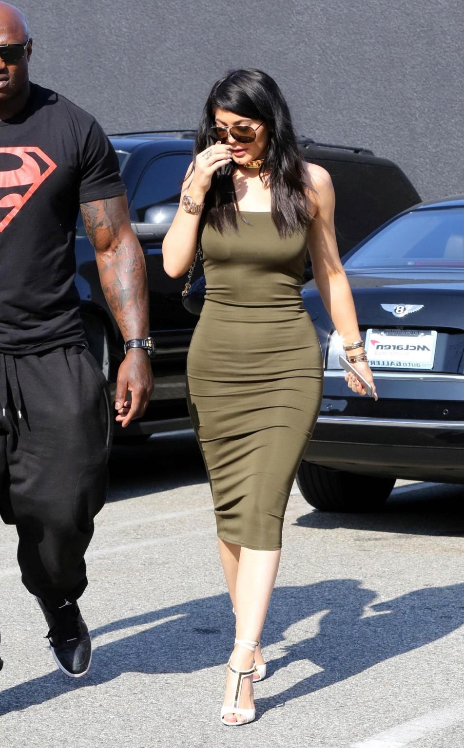 16P Kylie Jenner busty  braless wears a tight tube dress leaving a store in LA
