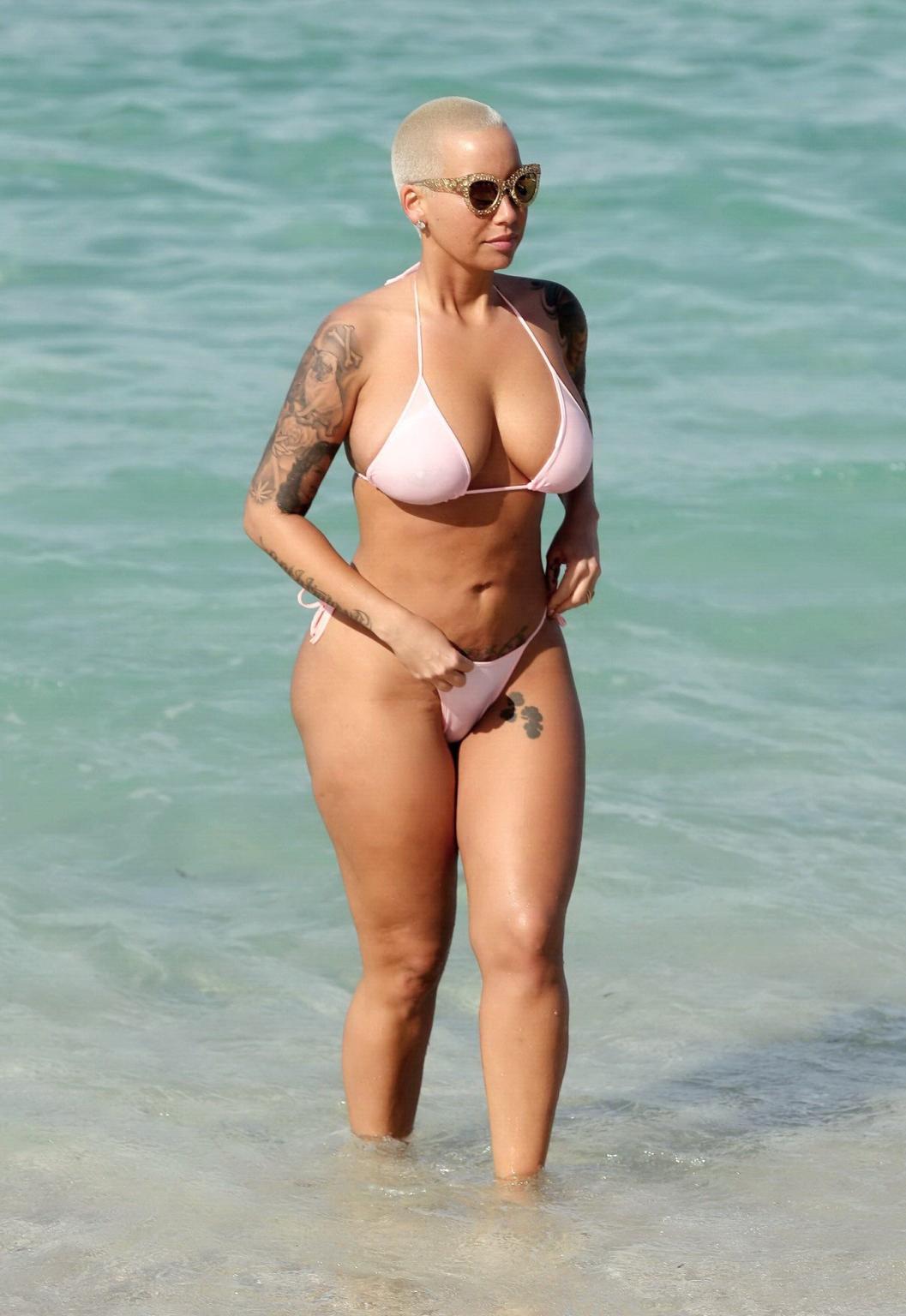 16P Amber Rose busty and booty wearing string bikini at the beach in Miami