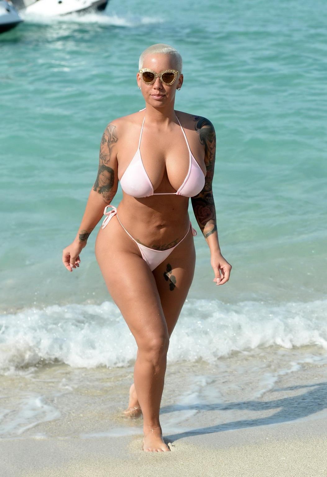 16P Amber Rose busty and booty wearing string bikini at the beach in Miami