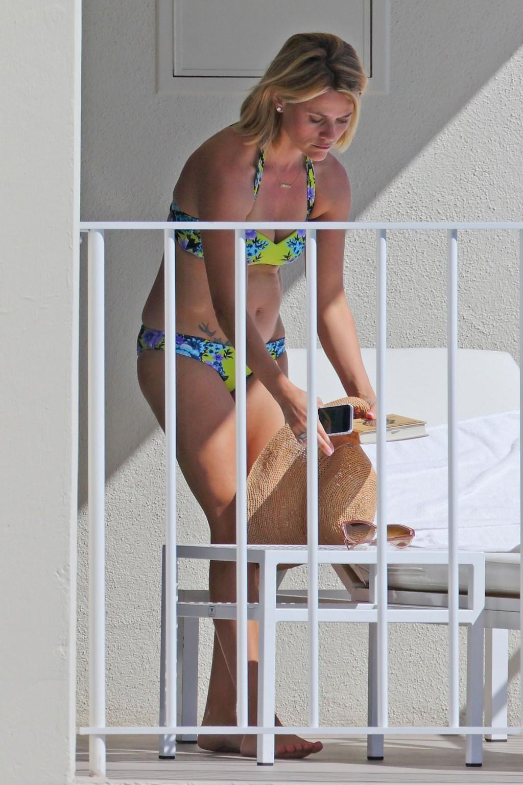 16P Reese Witherspoon wearing a nature colored bikini on a hotel balcony in Hawaii