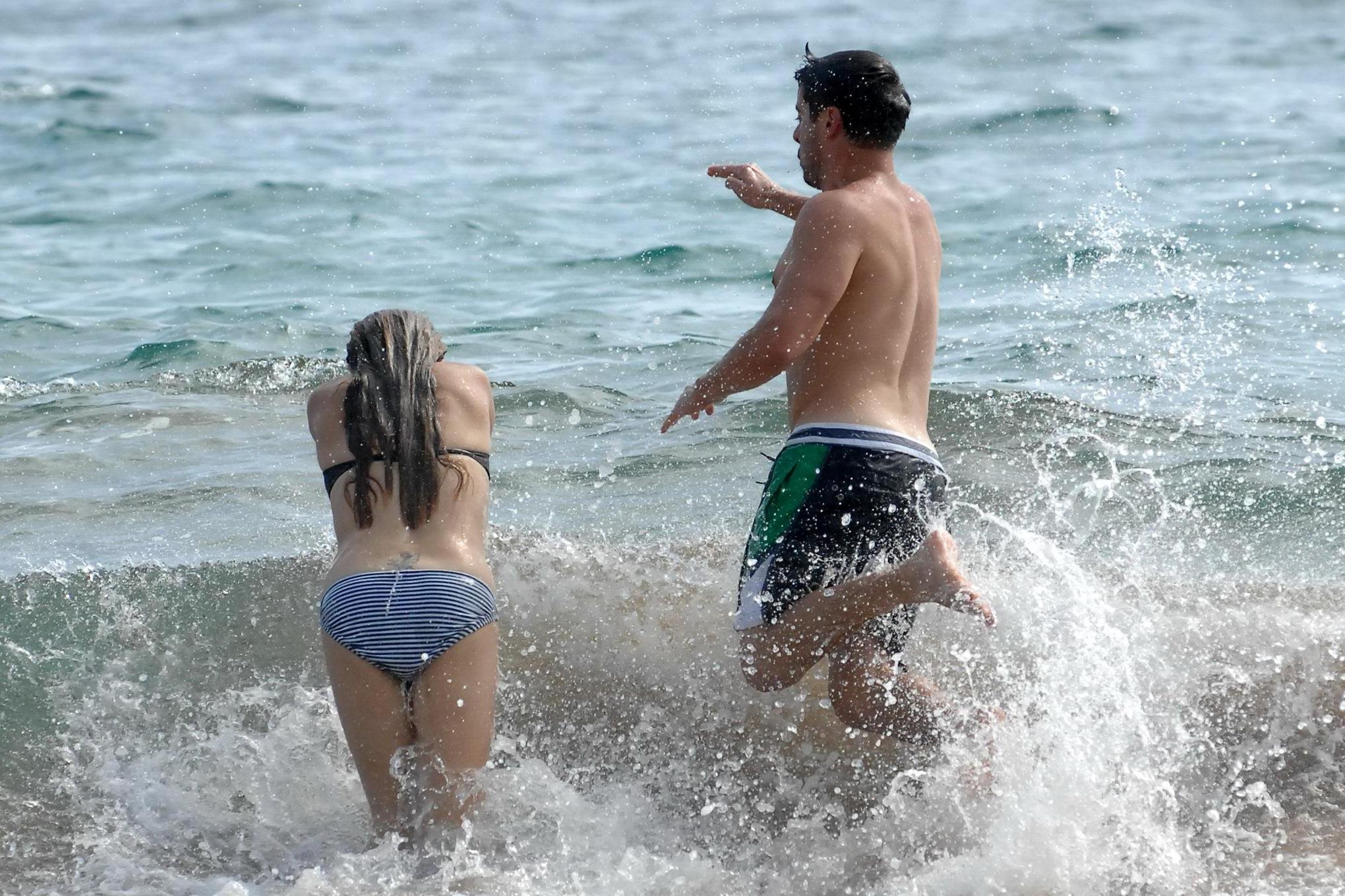 16P Danielle Fishel showing off her plump bikini body on a beach in Hawaii