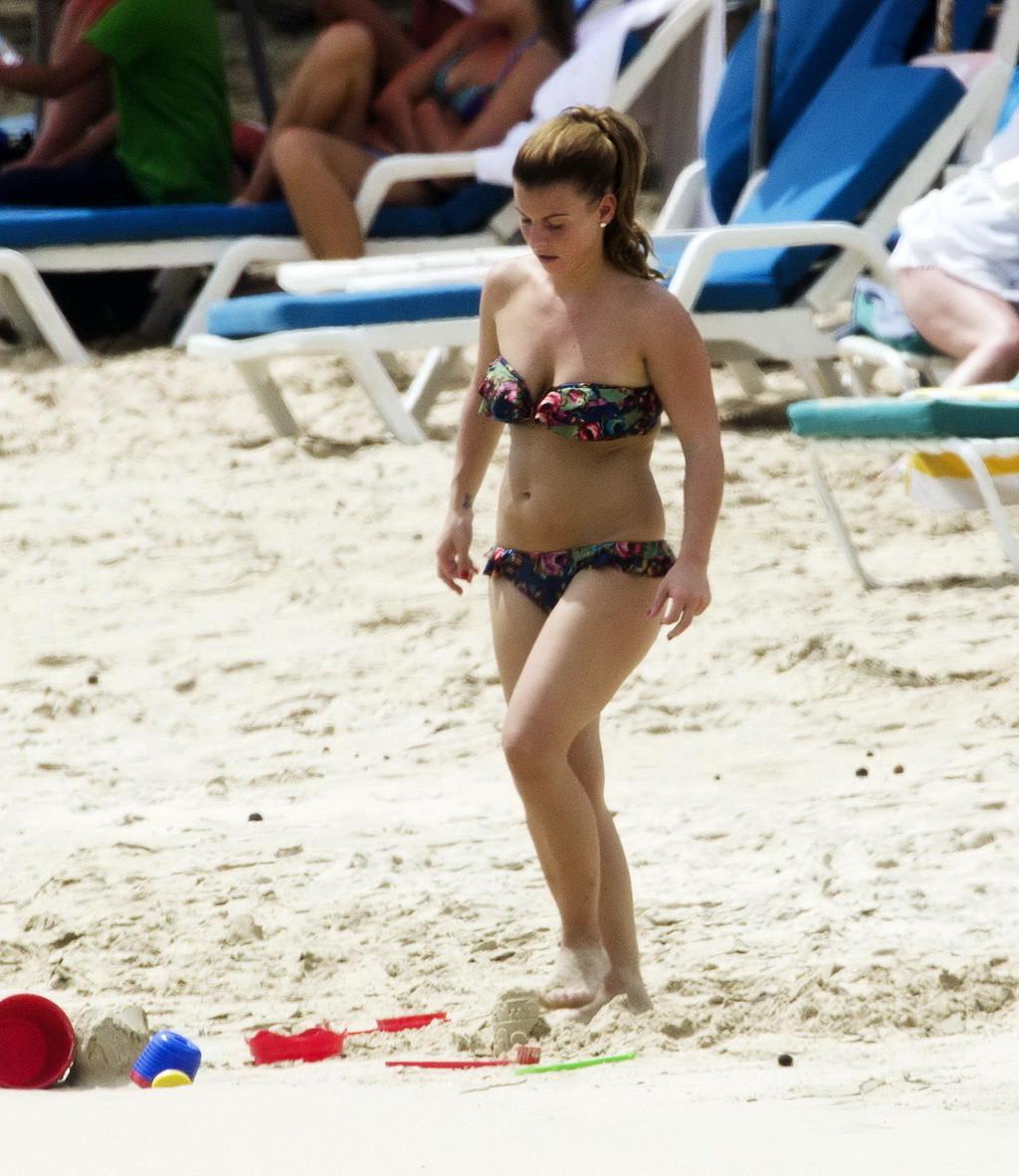 16P Coleen Rooney showing off her plump bikini body on a beach in Barbados
