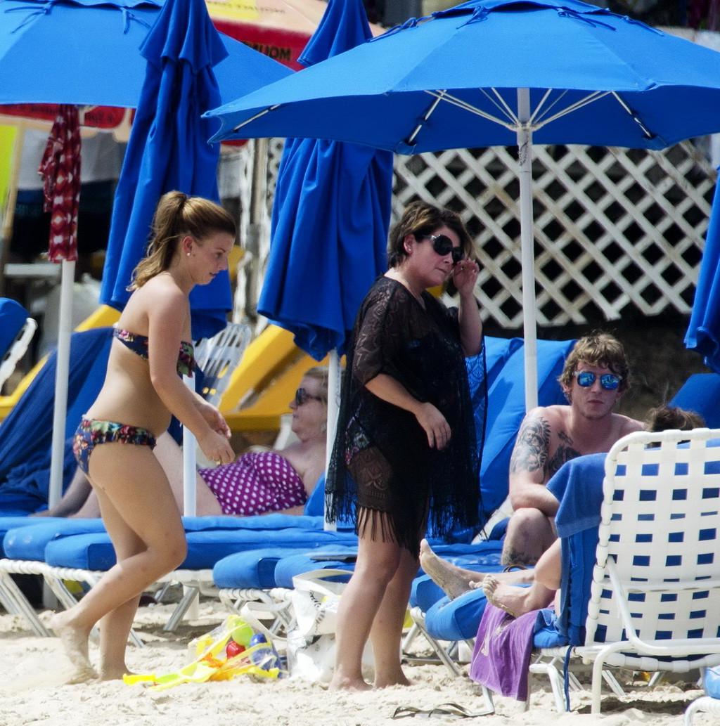 16P Coleen Rooney showing off her plump bikini body on a beach in Barbados