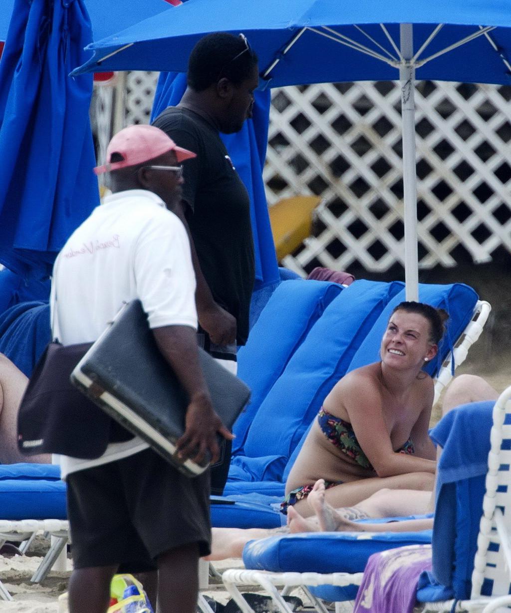16P Coleen Rooney showing off her plump bikini body on a beach in Barbados