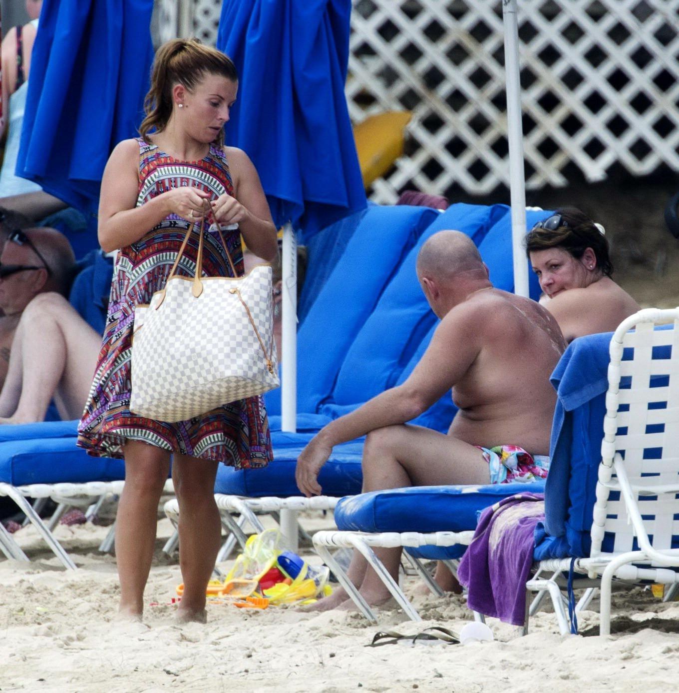 16P Coleen Rooney showing off her plump bikini body on a beach in Barbados