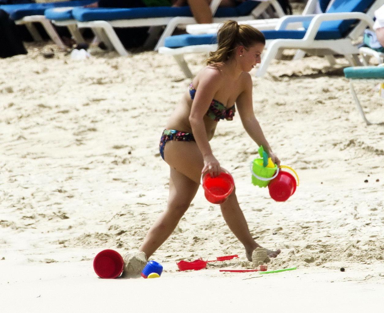 16P Coleen Rooney showing off her plump bikini body on a beach in Barbados