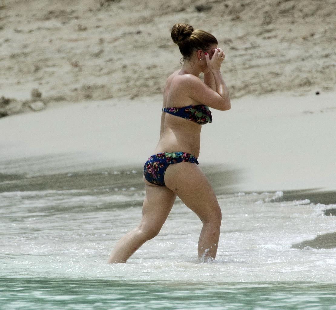 16P Coleen Rooney showing off her plump bikini body on a beach in Barbados