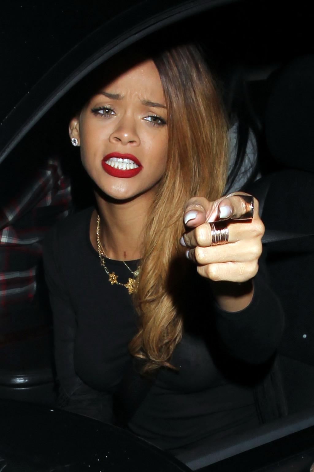 10P Rihanna shows her pierced boobs  black panties wearing a see through dress  in L
