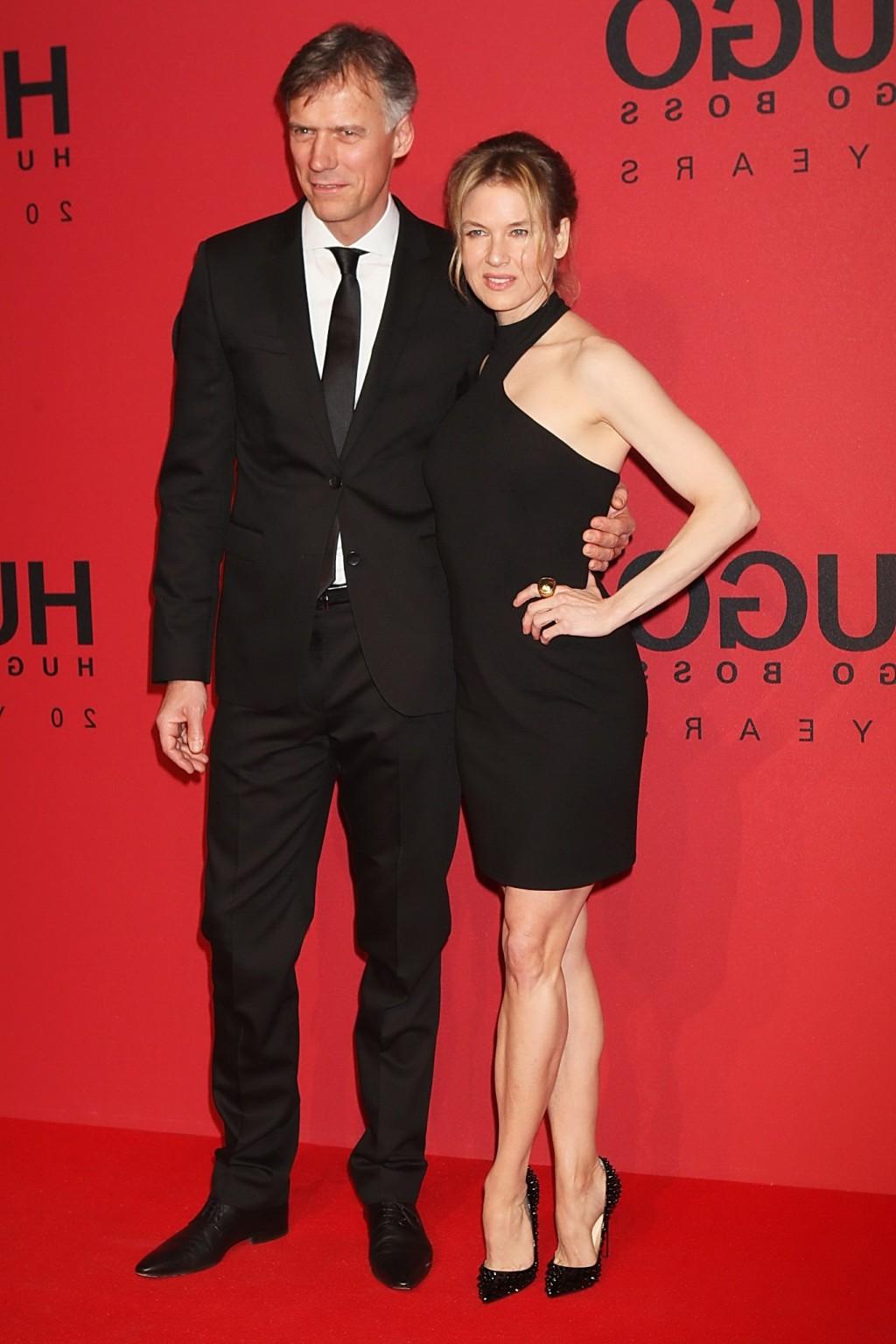 10P Renee Zellweger looks hot wearing black backless mini dress at the Hugo Boss fas