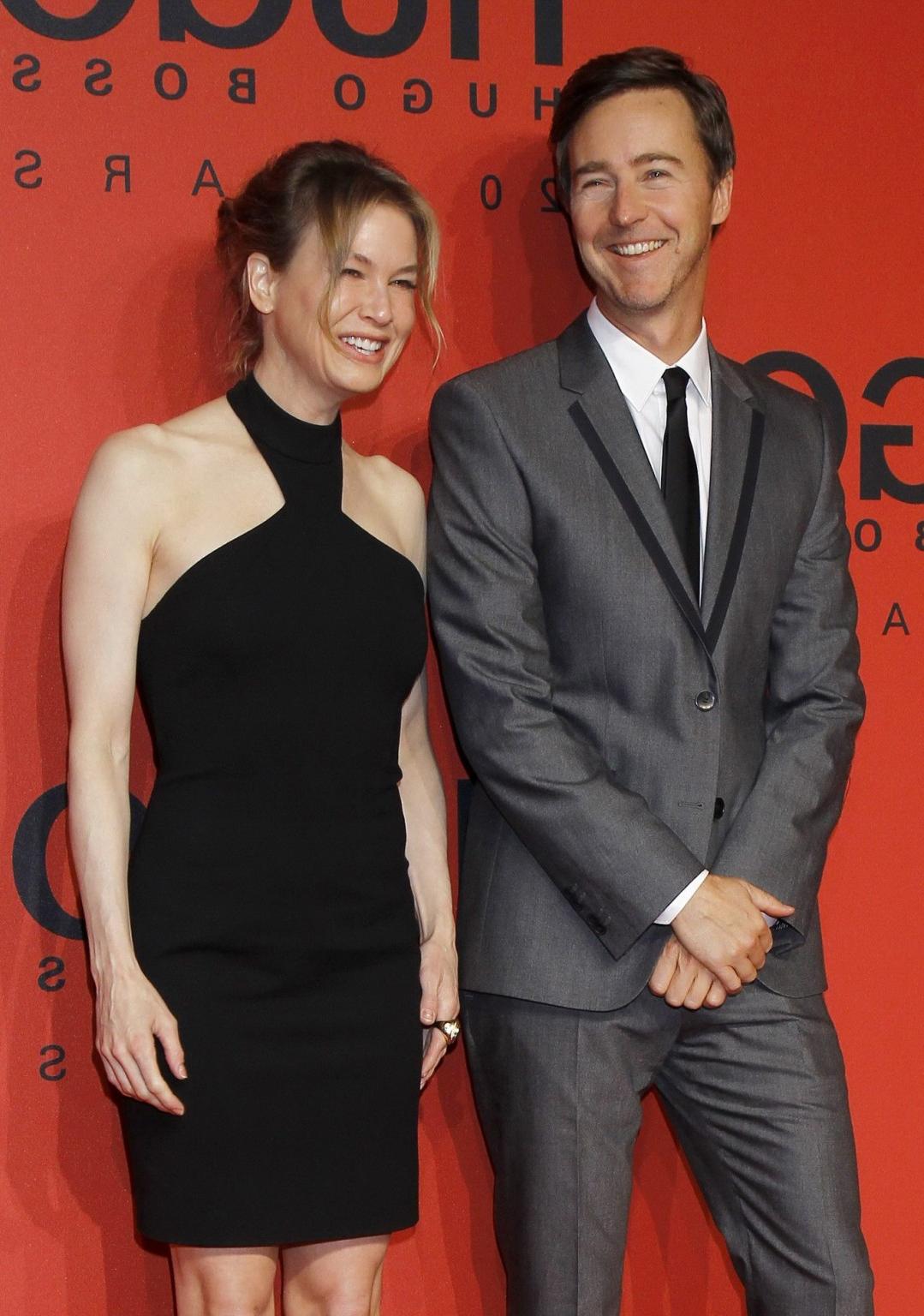 10P Renee Zellweger looks hot wearing black backless mini dress at the Hugo Boss fas