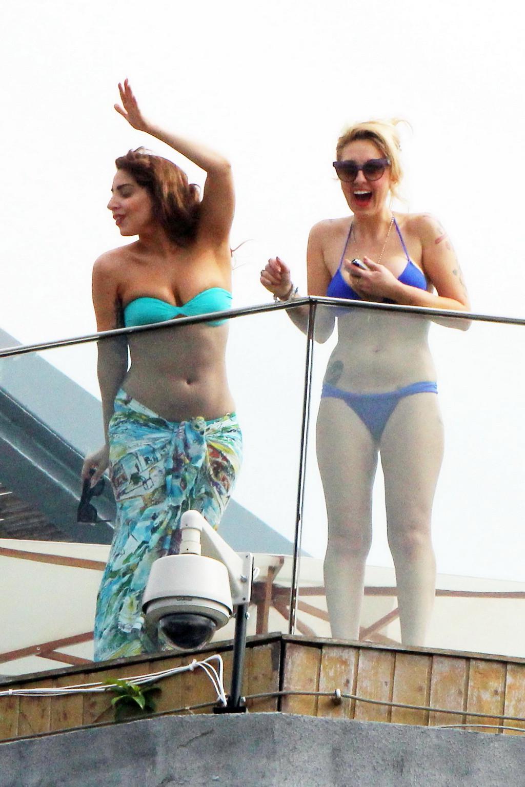 10P Lady Gaga topless on a hotel balcony in Rio trying to hide her boobs