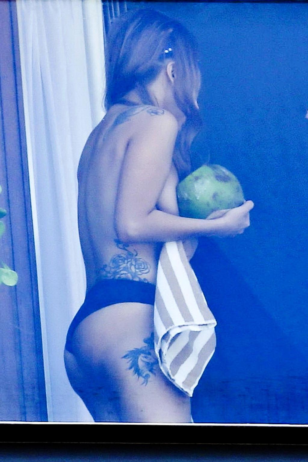 10P Lady Gaga topless on a hotel balcony in Rio trying to hide her boobs
