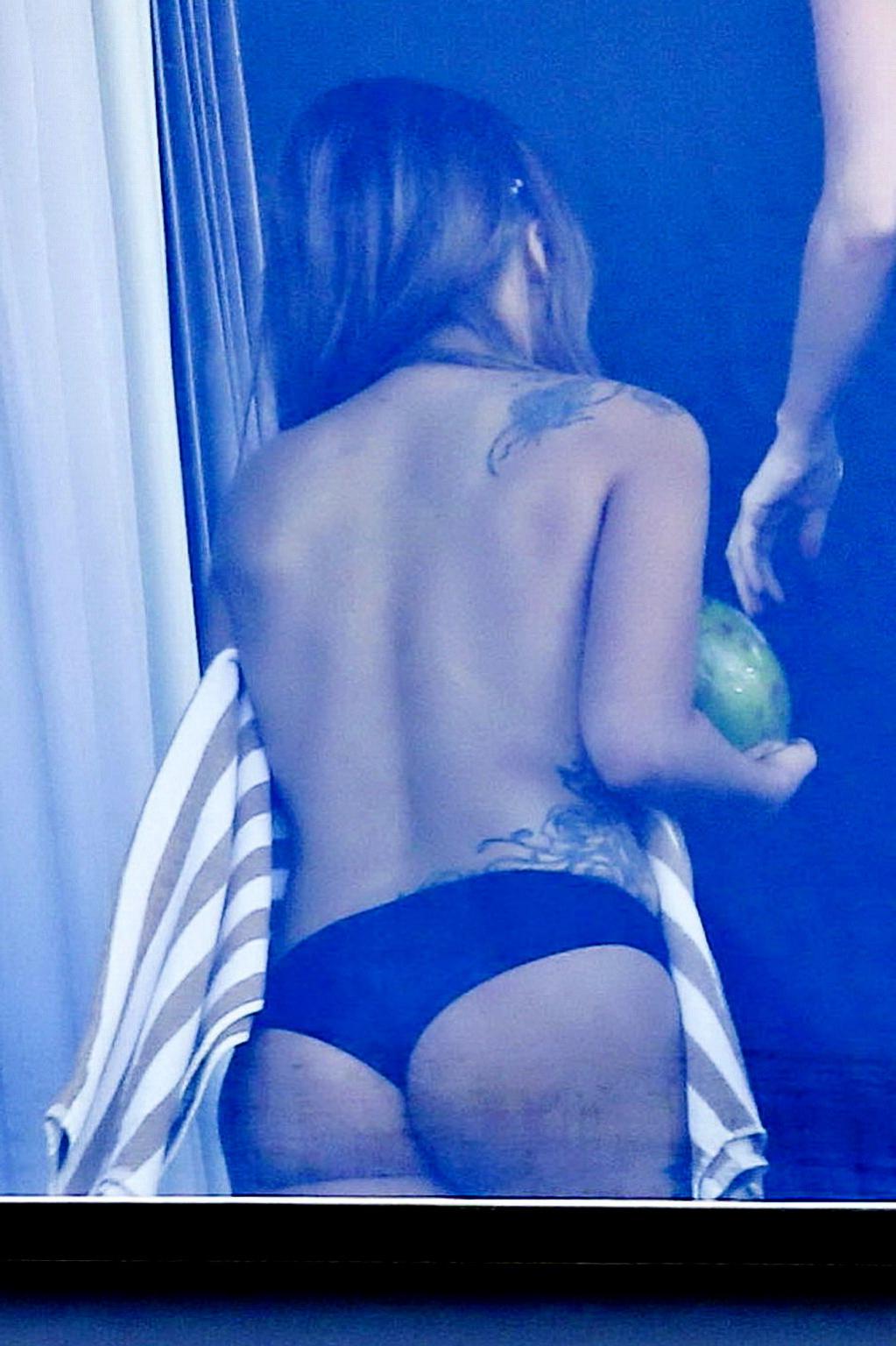 10P Lady Gaga topless on a hotel balcony in Rio trying to hide her boobs