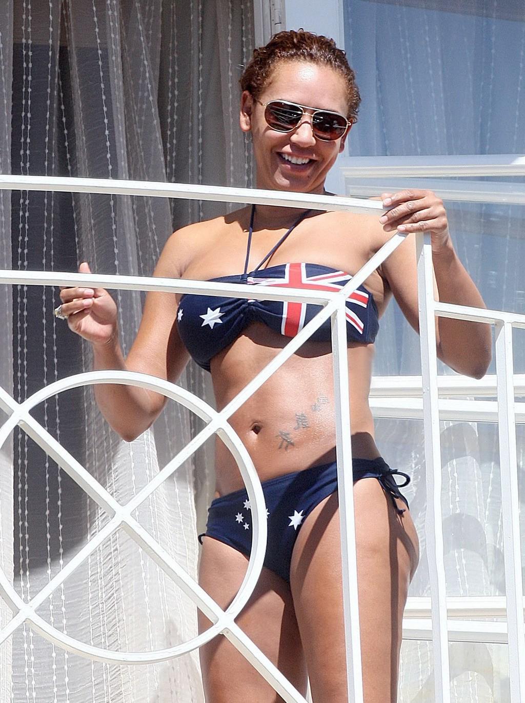 10P Melanie Brown in bikini caught by paparazzi while tanning on balcony in LA