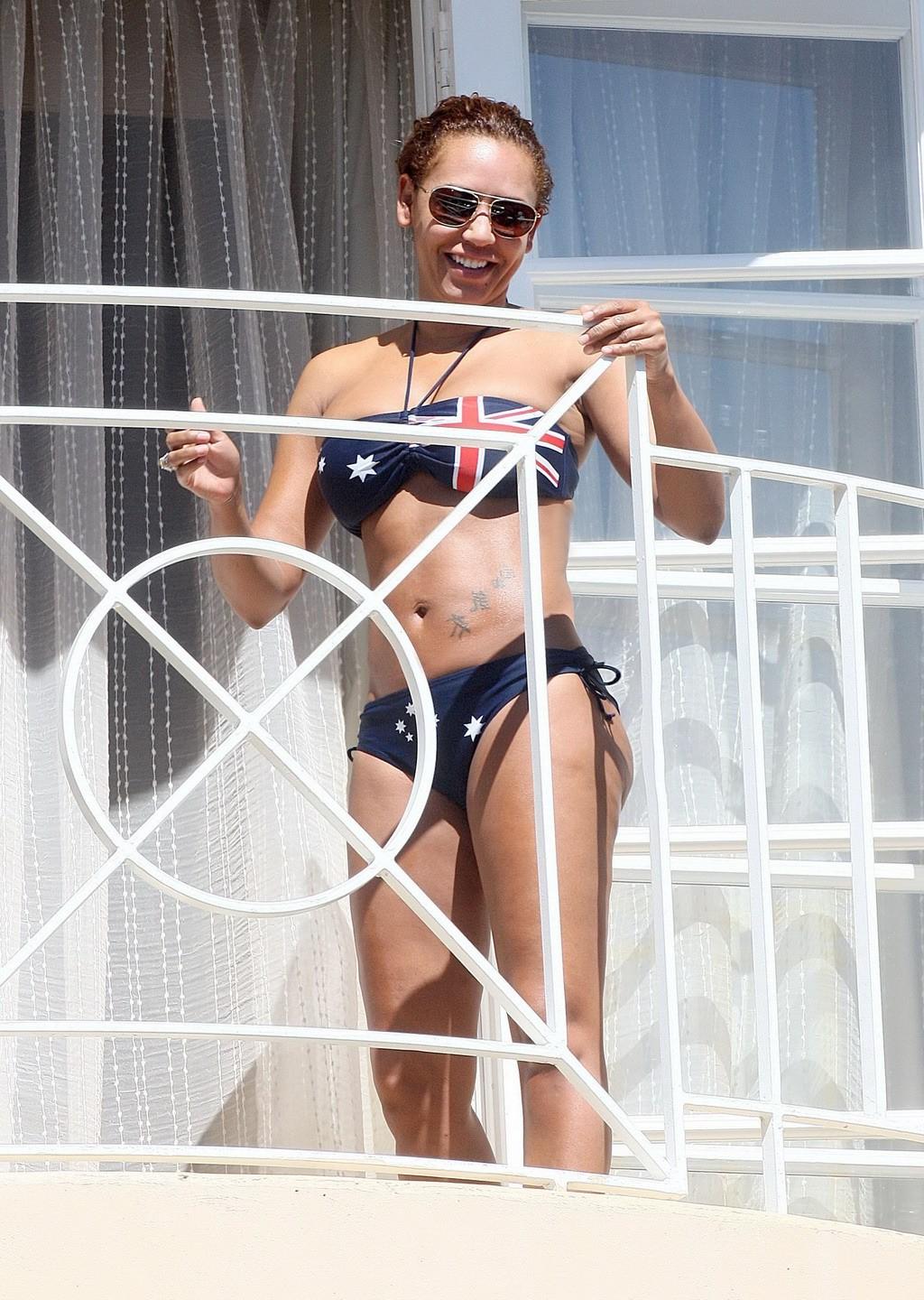 10P Melanie Brown in bikini caught by paparazzi while tanning on balcony in LA