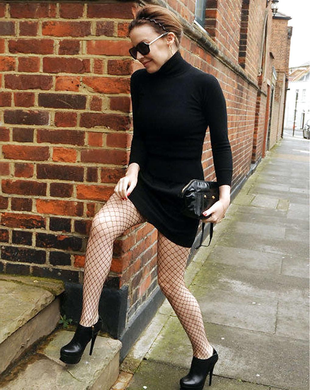 16P Kylie Minogue leggy in fishnets and mini skirt on street paparazzi pictures