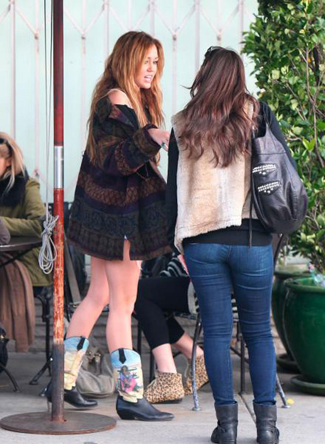 16P Miley Cyrus exposing sexy legs on street new paparazzi photos