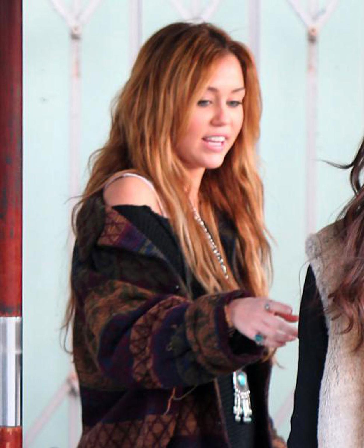 16P Miley Cyrus exposing sexy legs on street new paparazzi photos